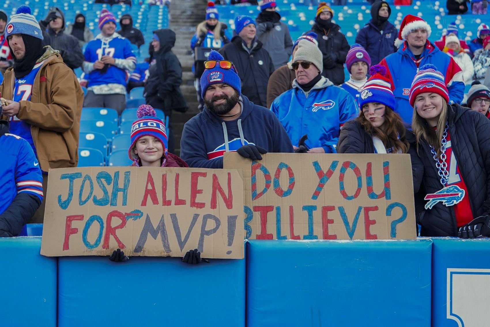 A young Buffalo Bills fan shows support for Buffalo Bills quarterback Josh Allen (17) for MVP during the second half against the New England Patriots at Highmark Stadium.