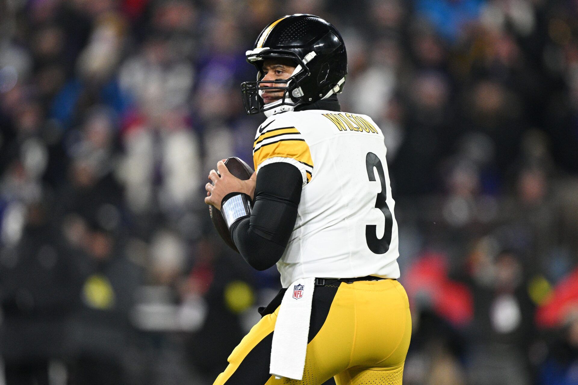 Pittsburgh Steelers quarterback Russell Wilson (3) looks to pass in the first quarter against the Baltimore Ravens in an AFC wild card game at M&T Bank Stadium.