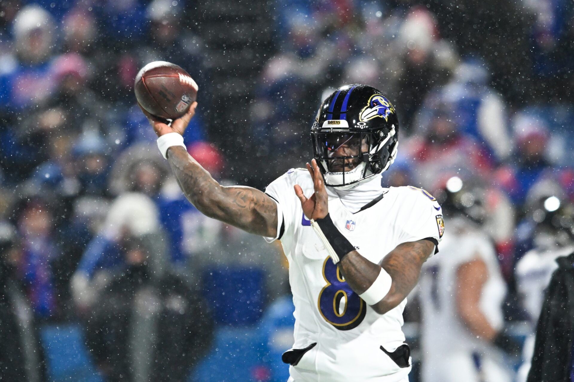 Baltimore Ravens quarterback Lamar Jackson (8) throws the ball during warm ups before the game against the Buffalo Bills in a 2025 AFC divisional round game at Highmark Stadium.