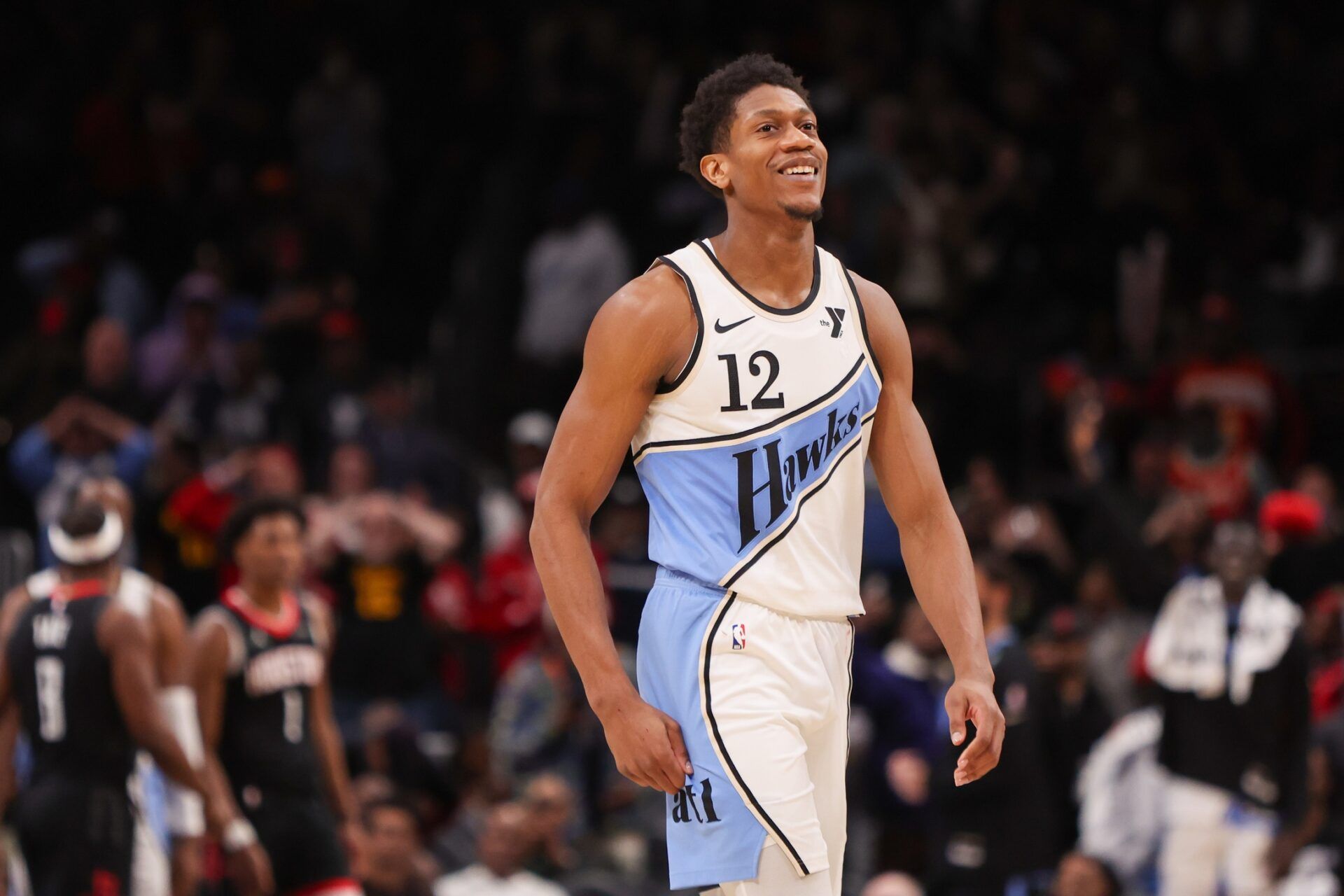 Atlanta Hawks forward De'Andre Hunter (12) reacts after a missed shot against the Houston Rockets in the fourth quarter at State Farm Arena.