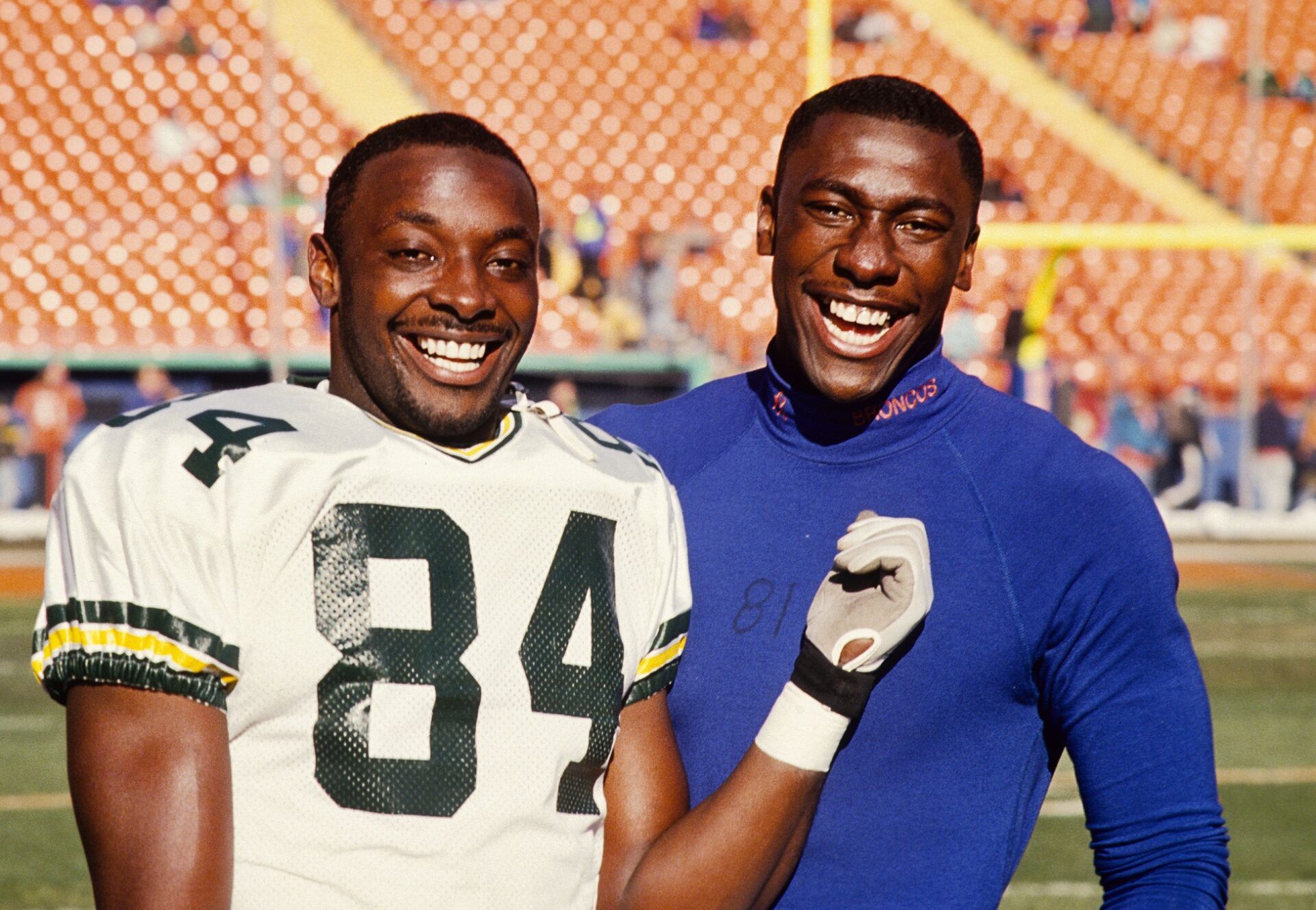 Hall of Fame receivers and brothers Sterling Sharpe (left) poses with his younger brother Shannon Sharpe (right) at Mile High Stadium.