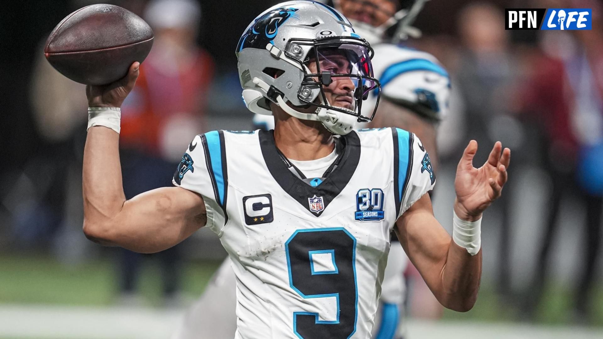 Carolina Panthers quarterback Bryce Young (9) passes on the run against the Atlanta Falcons during the second half at Mercedes-Benz Stadium.