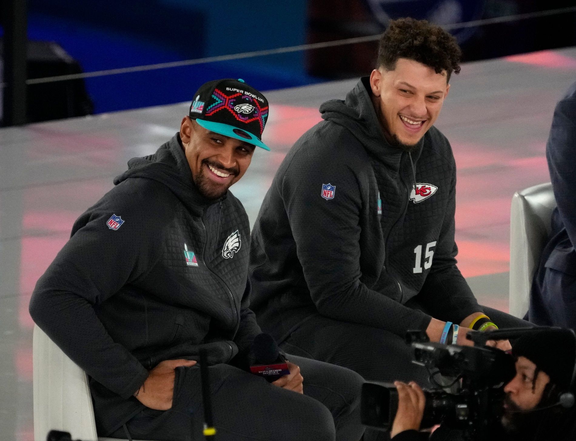 Philadelphia Eagles quarterback Jalen Hurts (1), left, and Kansas City Chiefs quarterback Patrick Mahomes (15) take the stage at the Footprint Center in downtown Phoenix during the NFL's Super Bowl Opening Night on Feb. 6, 2023.