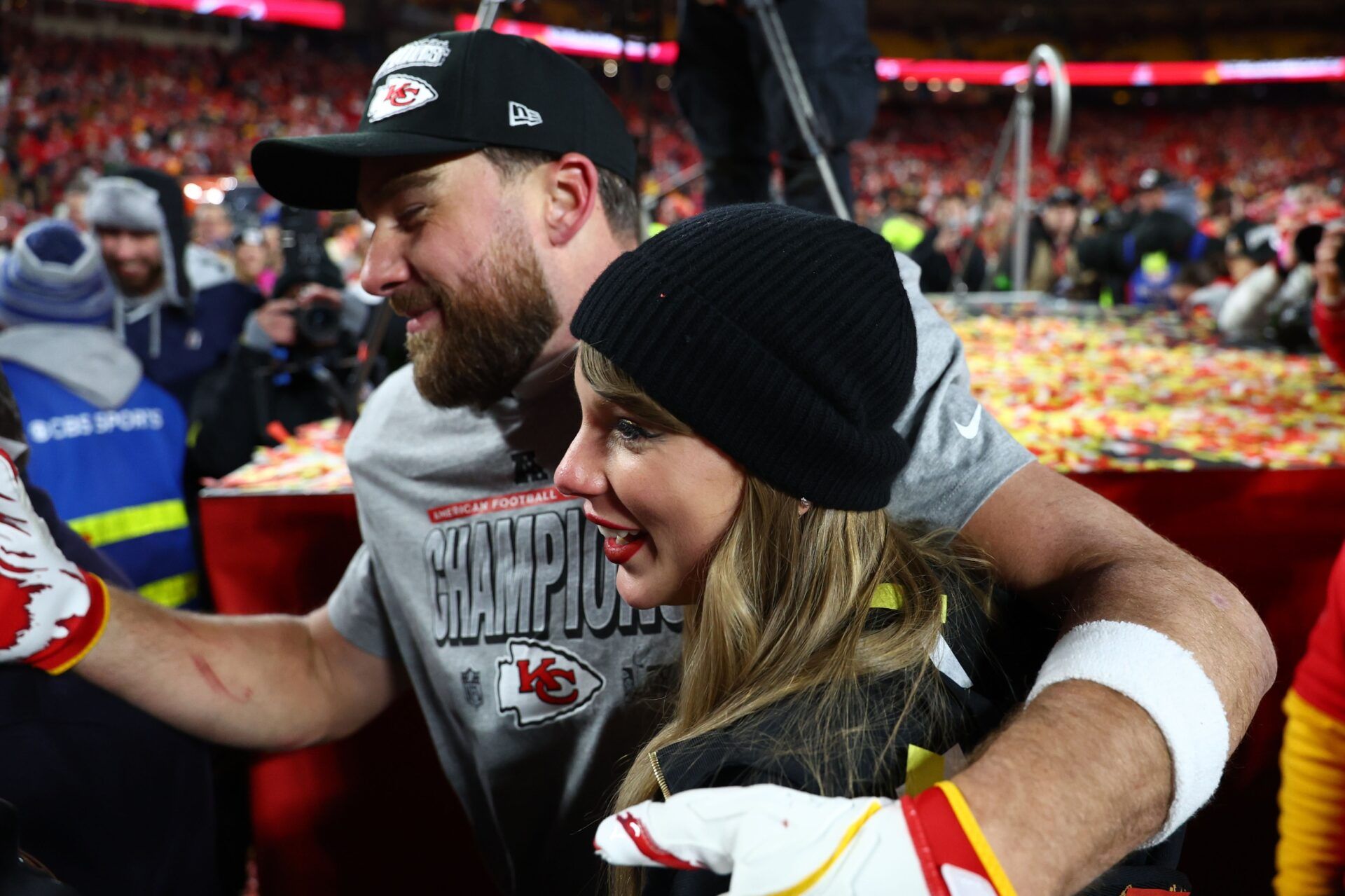 Recording artist Taylor Swift and Kansas City Chiefs tight end Travis Kelce (87) react after the AFC Championship game against the Buffalo Bills at GEHA Field at Arrowhead Stadium.