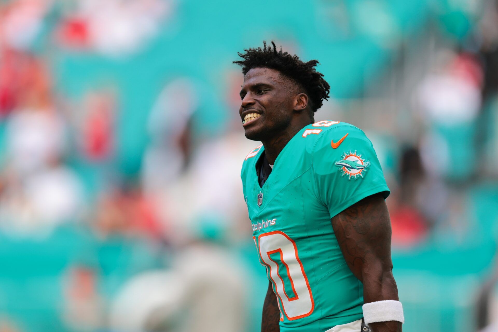 Miami Dolphins wide receiver Tyreek Hill (10) reacts on the field before the game against the San Francisco 49ers at Hard Rock Stadium.