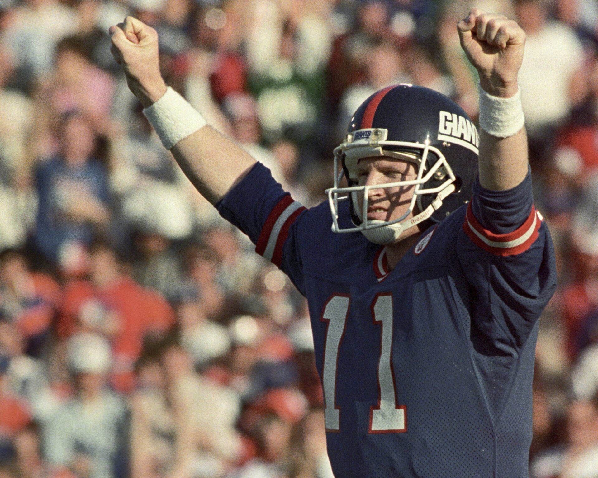 New York Giants quarterback Phil Simms (11) reacts on the field against the Denver Broncos during Super Bowl XXI at the Rose Bowl. The Giants defeated the Broncos 39-20.