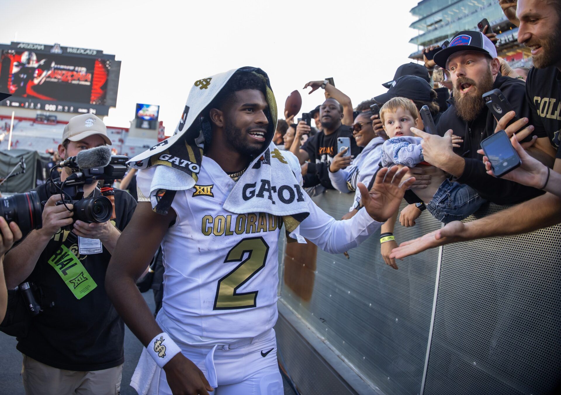 Colorado Buffalos quarterback Shedeur Sanders (2) greets fans after defeating the Arizona Wildcats at Arizona Stadium.