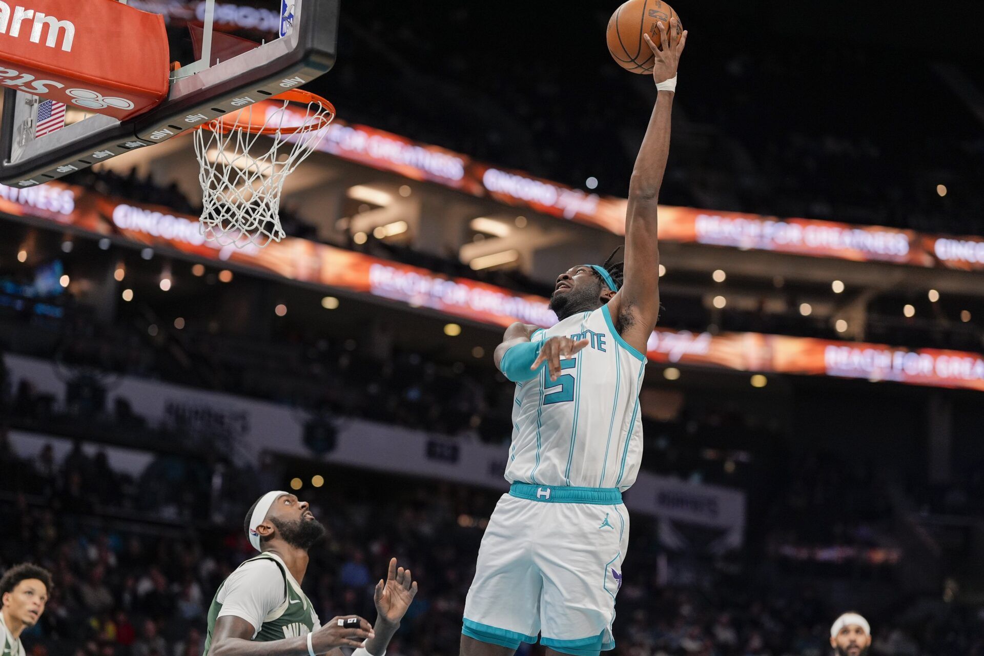 Charlotte Hornets center Mark Williams (5) lays in the basket over Milwaukee Bucks forward Bobby Portis (9) during the second half at Spectrum Center.