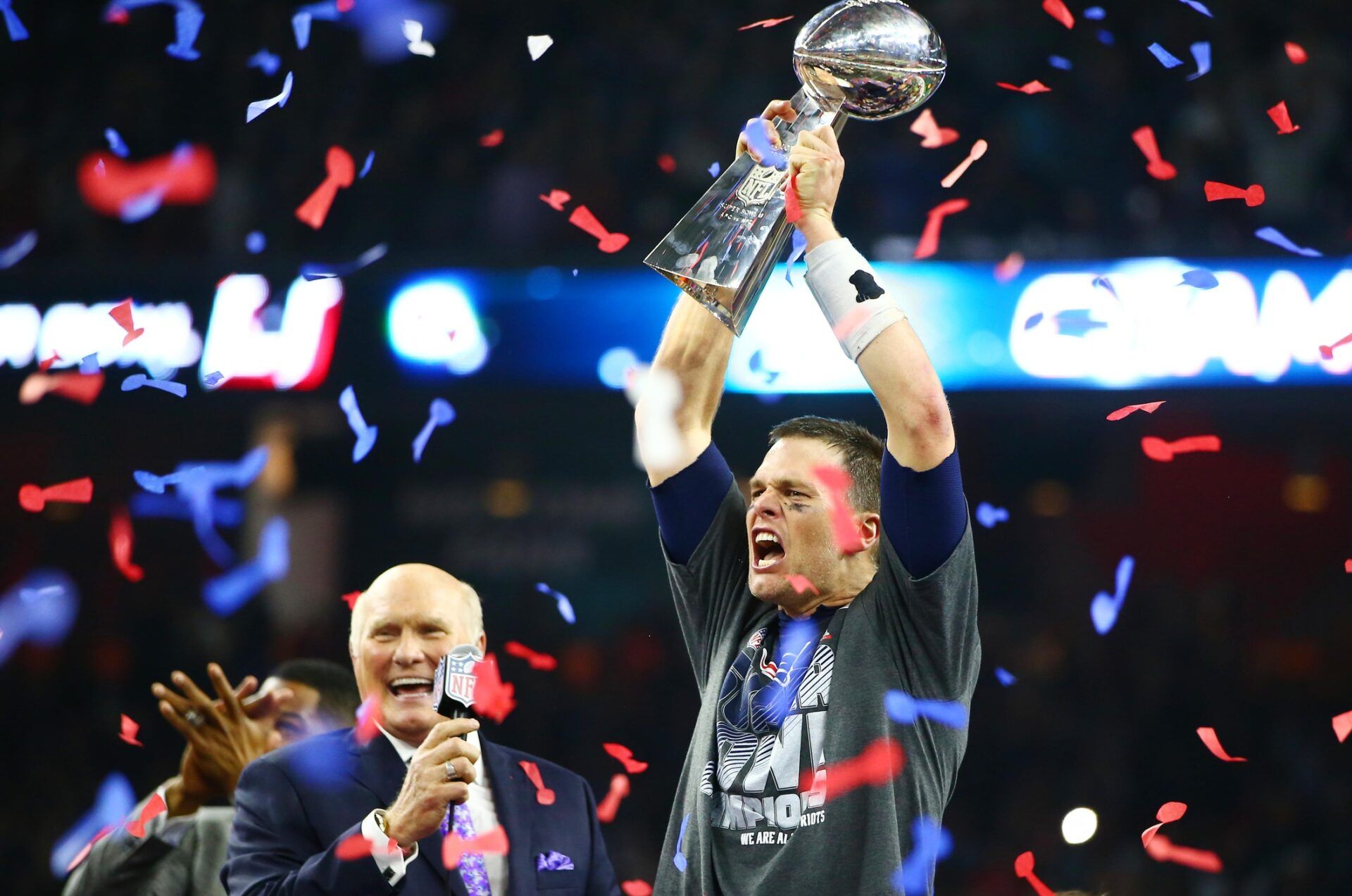 New England Patriots quarterback Tom Brady (12) celebrates with the Vince Lombardi Trophy after defeating the Atlanta Falcons during Super Bowl LI at NRG Stadium.