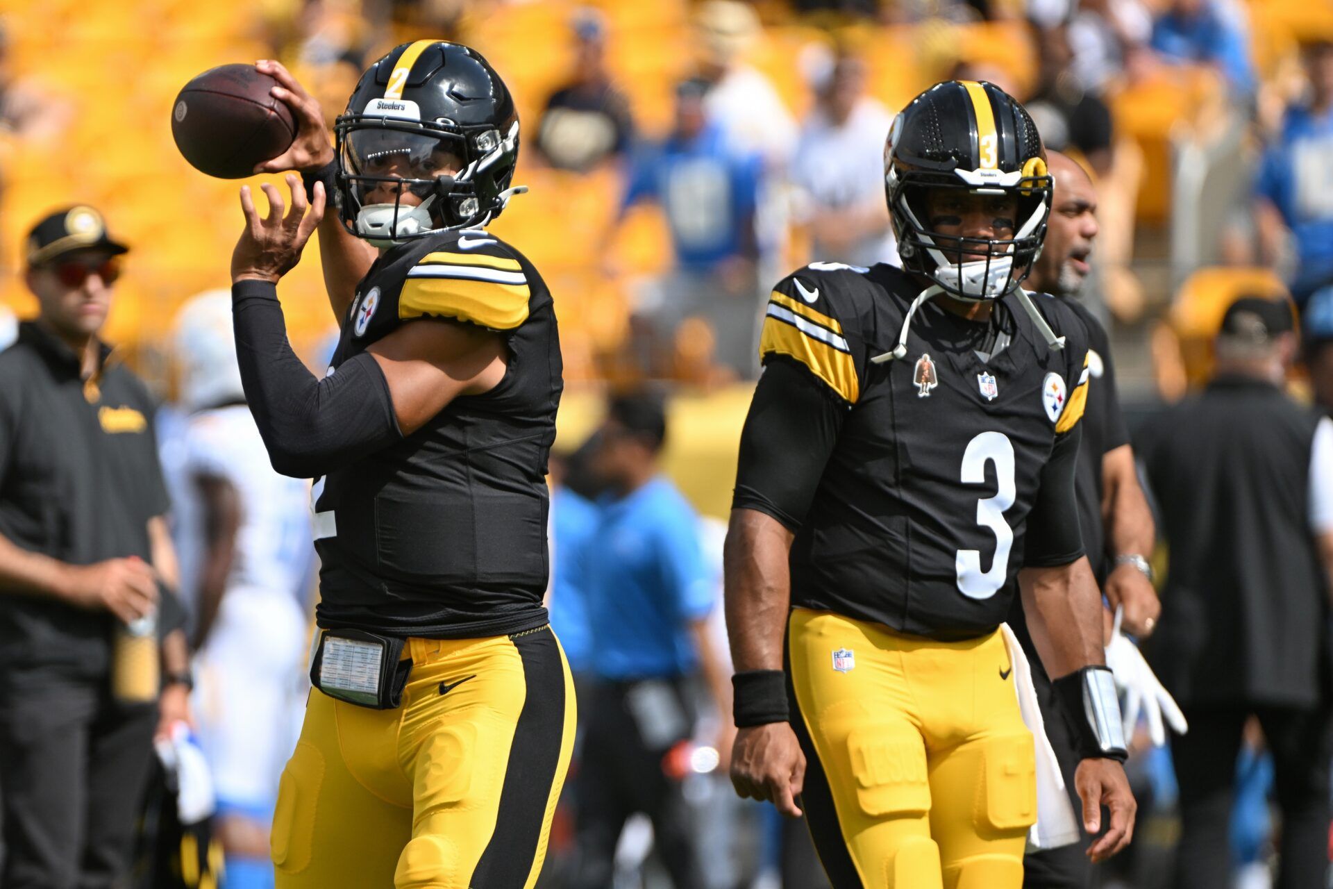 Pittsburgh Steelers quarterback Justin Fields (2) warms up next to quarterback Russell Wilson (3) before a game against the Los Angeles Chargers at Acrisure Stadium.