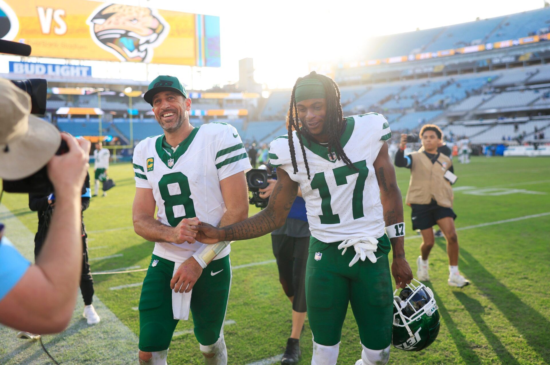 New York Jets quarterback Aaron Rodgers (8) and wide receiver Davante Adams (17) high-five each other as they walks off the field after the game Sunday, Dec. 15, 2024 at EverBank Stadium in Jacksonville, Fla. The Jets held off the Jaguars 32-25.