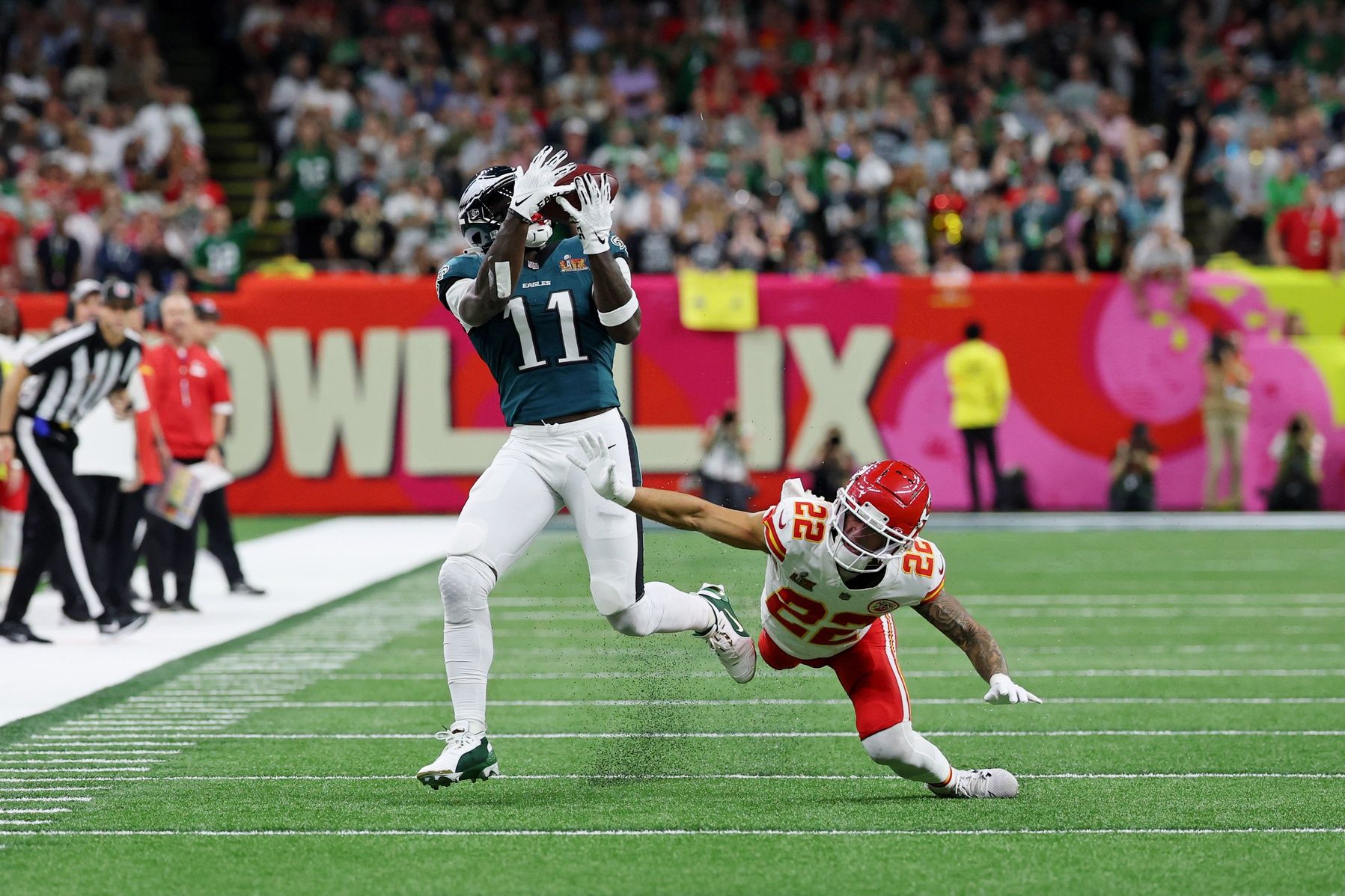 Philadelphia Eagles wide receiver A.J. Brown (11) makes a catch against Kansas City Chiefs cornerback Trent McDuffie (22) during the first half of Super Bowl LIX at Caesars Superdome.