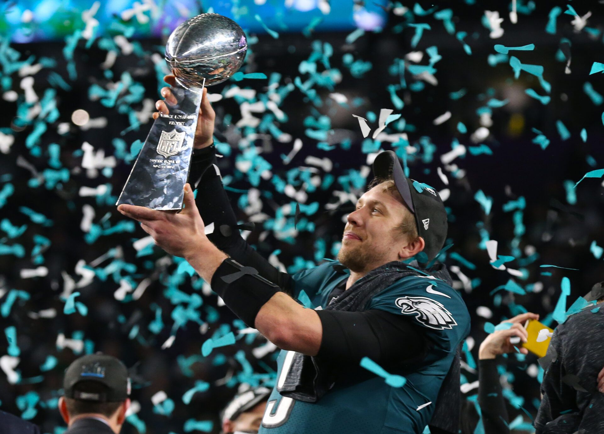 Feb 4, 2018; Minneapolis, MN, USA; Philadelphia Eagles quarterback Nick Foles (9) hoist the Vince Lombardi Trophy after a victory against the New England Patriots in Super Bowl LII at U.S. Bank Stadium. Mandatory Credit: Matthew Emmons-USA TODAY Sports