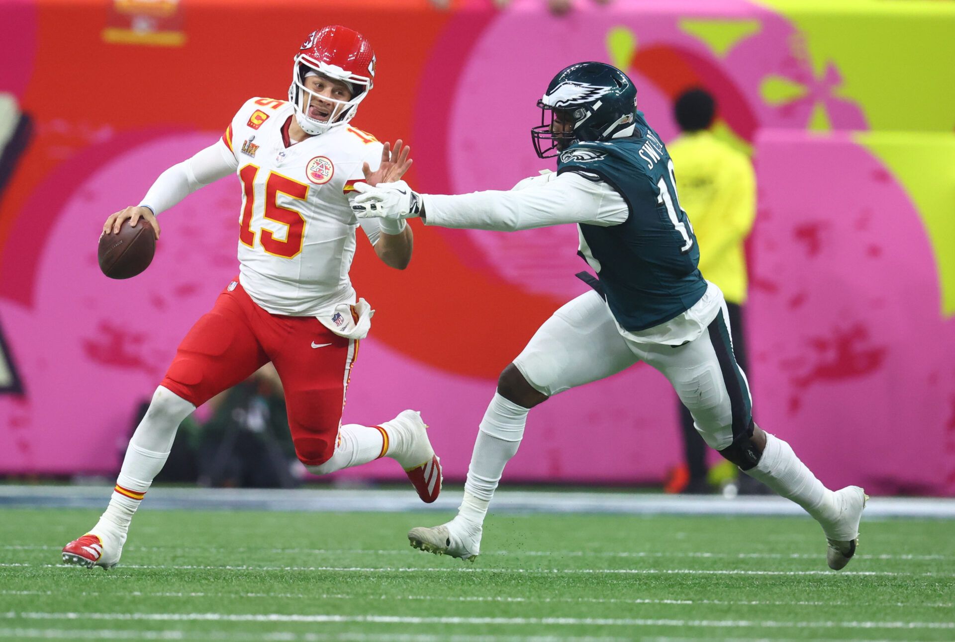 Feb 9, 2025; New Orleans, LA, USA; Kansas City Chiefs quarterback Patrick Mahomes (15) is tackled by Philadelphia Eagles linebacker Josh Sweat (19) in Super Bowl LIX between the Philadelphia Eagles and the Kansas City Chiefs at Ceasars Superdome. Mandatory Credit: Mark J. Rebilas-Imagn Images