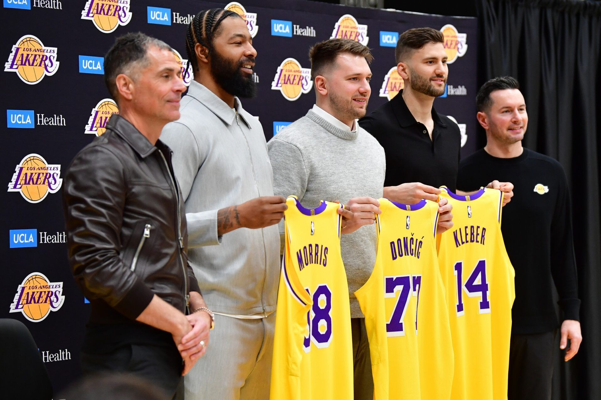 Los Angeles Lakers guard Luka Doncic, forward Max Kleber, forward Markieff Morris, vice president of basketball operations Rob Pelinka and head coach JJ Redick pose for photos at UCLA Health Training Center.