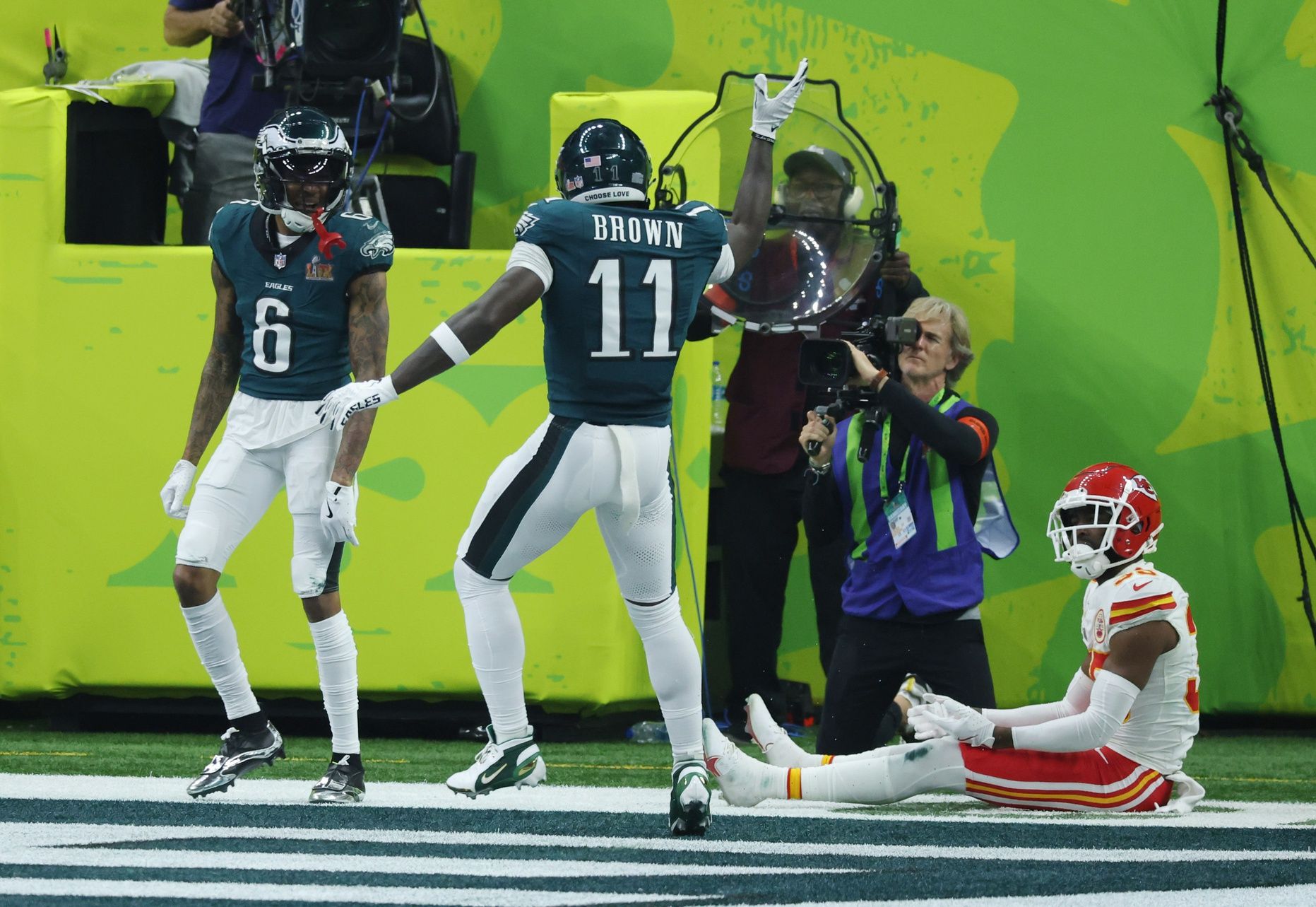 Philadelphia Eagles wide receiver DeVonta Smith (6) celebrates with Philadelphia Eagles wide receiver A.J. Brown (11) after scoring a touchdown against the Kansas City Chiefs in the third quarter in Super Bowl LIX at Ceasars Superdome.