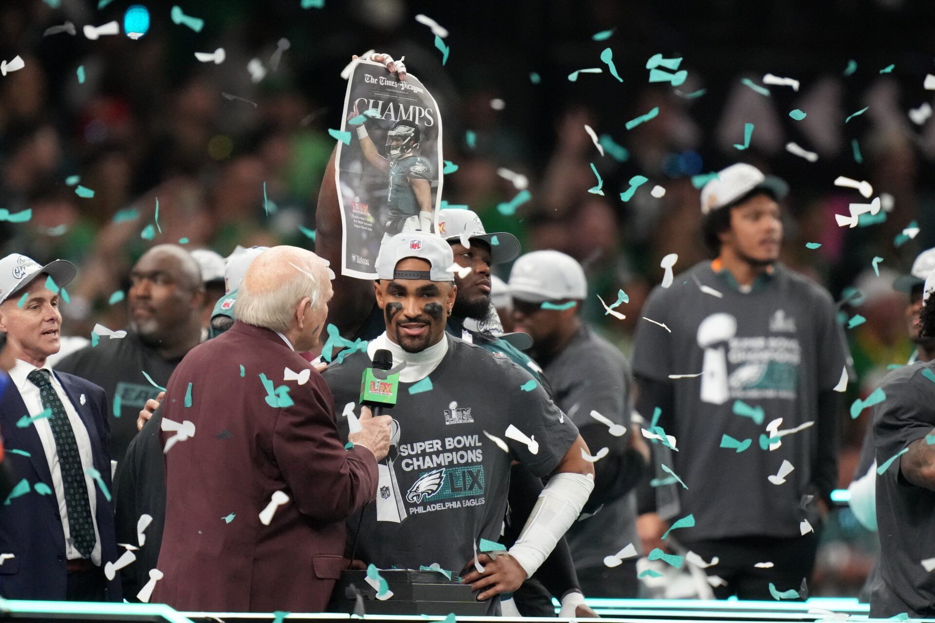 Philadelphia Eagles quarterback Jalen Hurts (1) talks with Fox announcer Terry Bradshaw after defeating the Kansas City Chiefs in Super Bowl 59 at Caesars Superdome.