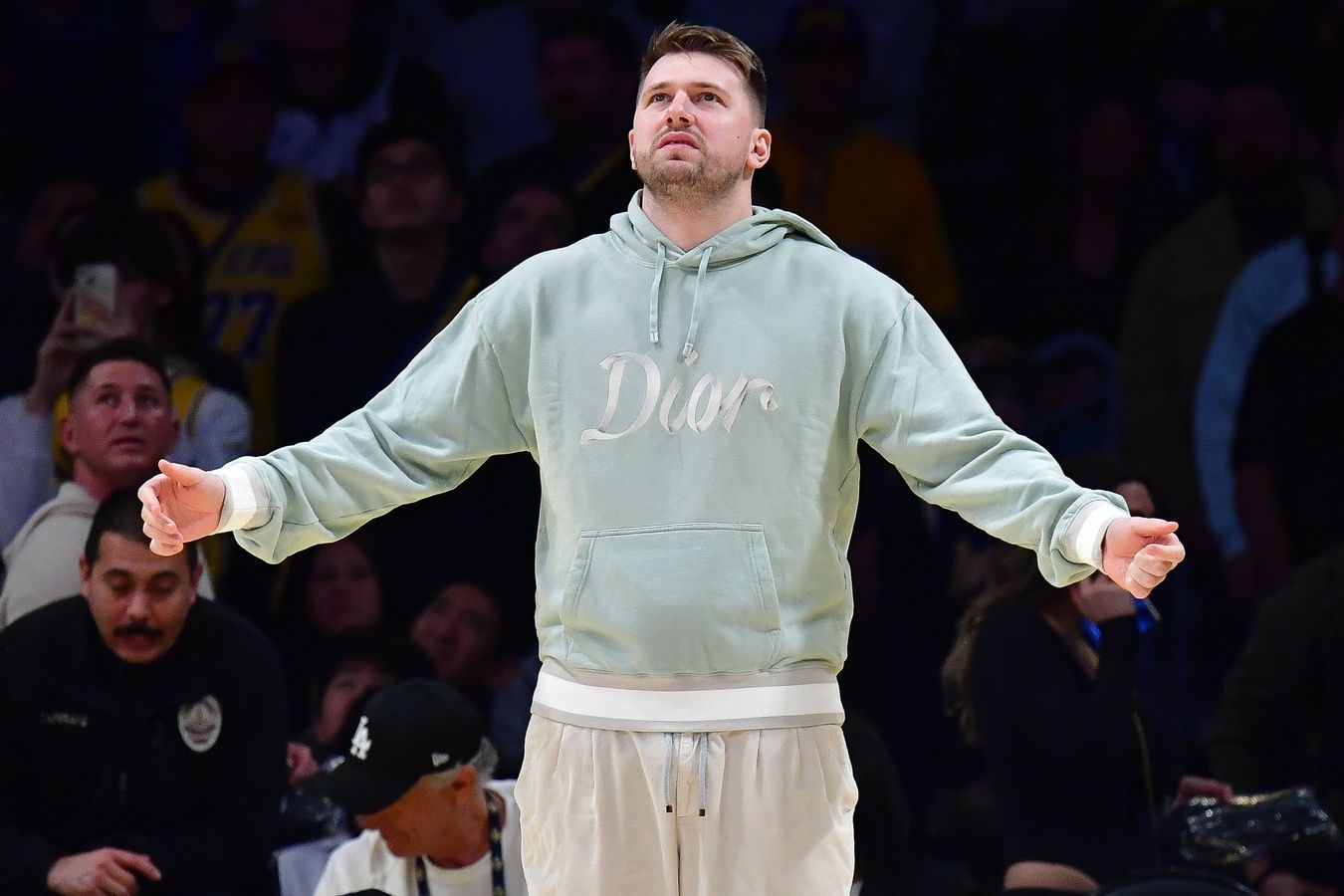 Los Angeles Lakers guard Luka Doncic (77) reacts watching game action against the Indiana Pacers during the second half at Crypto.com Arena.