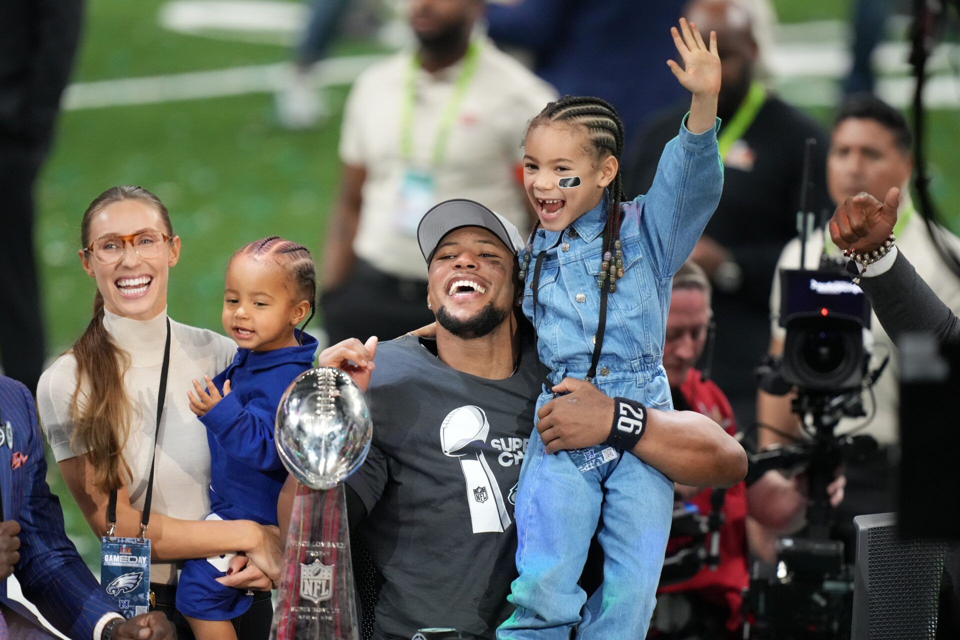 Philadelphia Eagles running back Saquon Barkley (26) talks to the media with his daughter, Jada, after defeating the Kansas City Chiefs in Super Bowl LIX at Caesars Superdome.