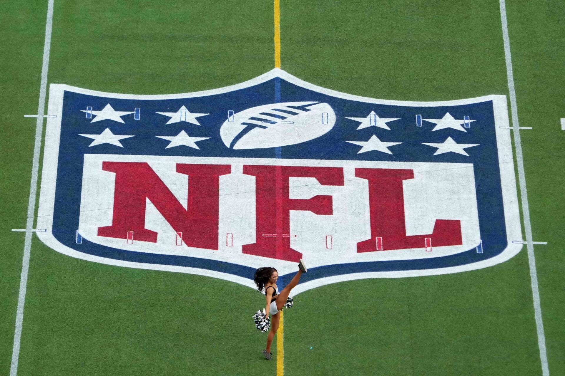 Philadelphia Eagles cheerleader Arielle Hunt performs on the NFL shield logo during the 2025 Pro Bowl Games at Camping World Stadium.