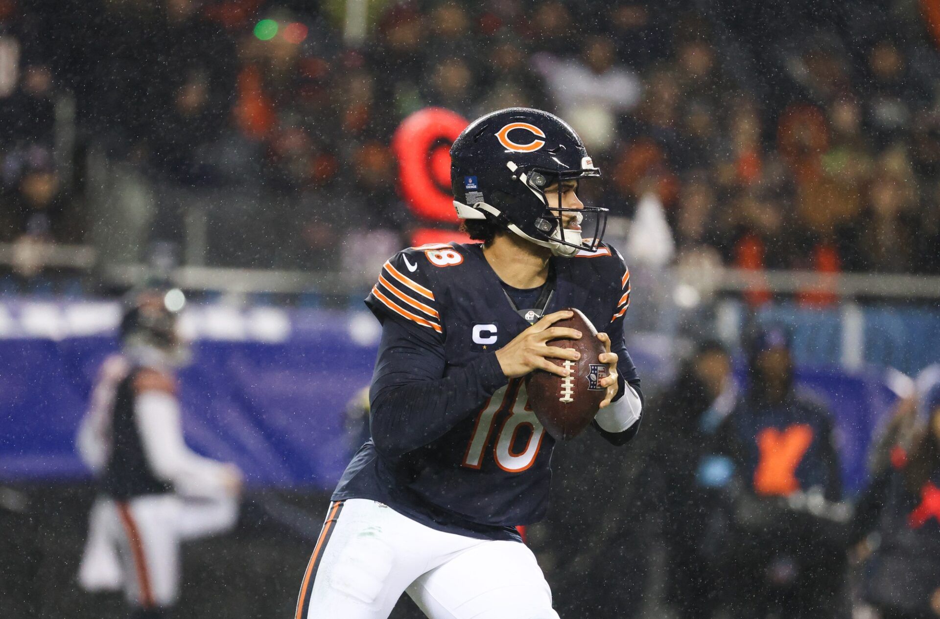 Chicago Bears quarterback Caleb Williams (18) rolls out of the pocket during the third quarter against the Seattle Seahawks at Soldier Field.