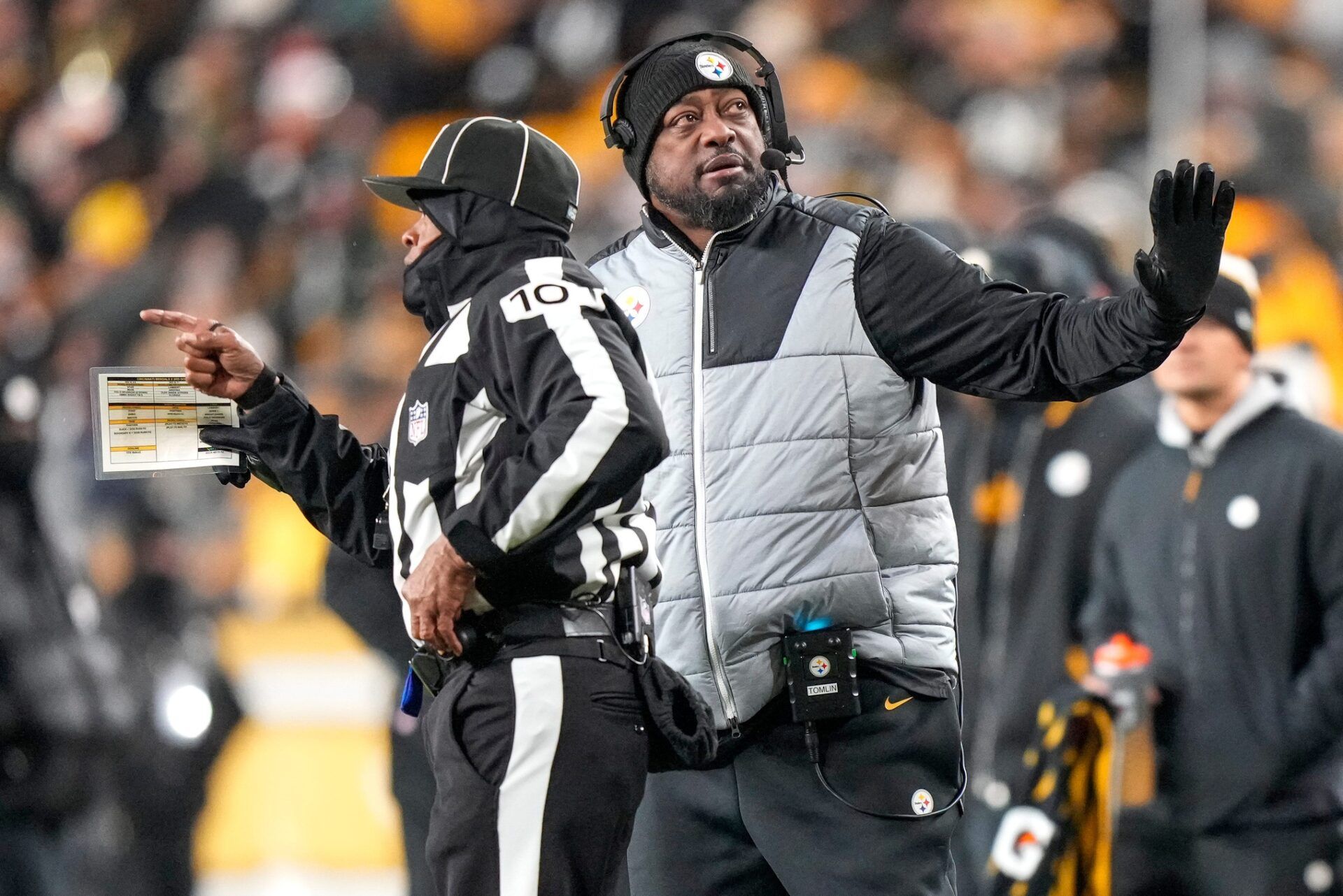 Pittsburgh Steelers head coach Mike Tomlin sets up a timeout in the second quarter of the NFL Week 18 game between the Pittsburgh Steelers and the Cincinnati Bengals at Acrisure Stadium in Pittsburgh on Saturday, Jan. 4, 2025.