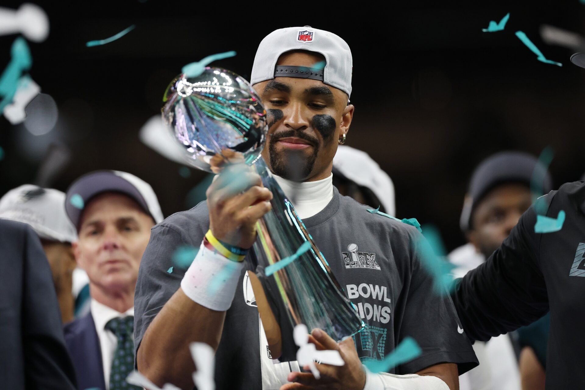 Philadelphia Eagles quarterback Jalen Hurts holds the Lombardi Trophy during the championship trophy presentation after the Eagles' game against the Kansas City Chiefs in Super Bowl LIX at Caesars Superdome.