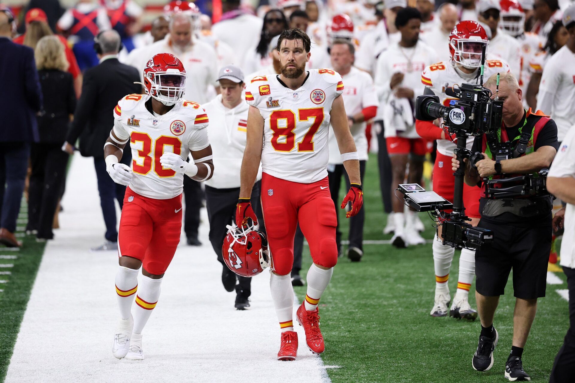 Kansas City Chiefs tight end Travis Kelce (87) walks off the field at the end of the first half of Super Bowl LIX at Caesars Superdome.