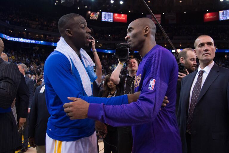 Golden State Warriors forward Draymond Green (23, left) and Los Angeles Lakers forward Kobe Bryant (24, right) talk after the game at Oracle Arena. The Warriors defeated the Lakers 116-98.