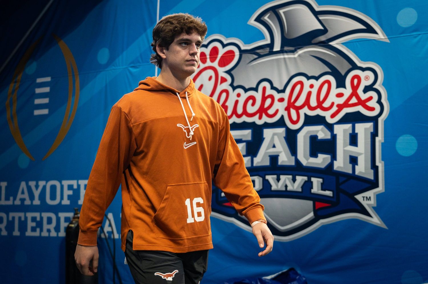 Texas Longhorns quarterback Arch Manning (16) walks onto the field as the Texas Longhorns prepare to play the Arizona State Sun Devils in the Peach Bowl College Football Playoff quarterfinal at Mercedes-Benz Stadium in Atlanta, Georgia, Jan. 1, 2025.