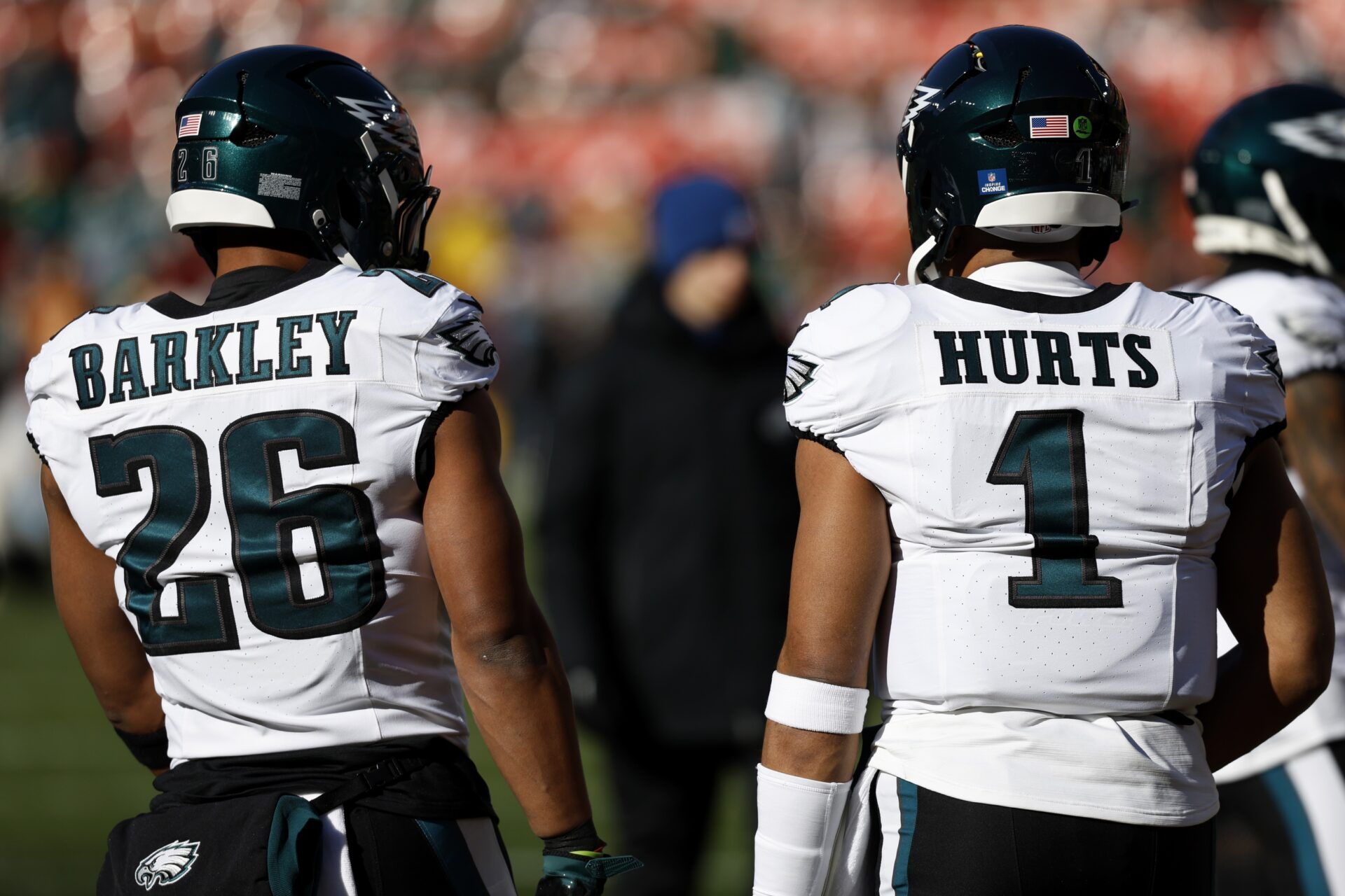 Philadelphia Eagles running back Saquon Barkley (26) and Eagles quarterback Jalen Hurts (1) stand on the field during warmup prior to the game against the Washington Commanders at Northwest Stadium.