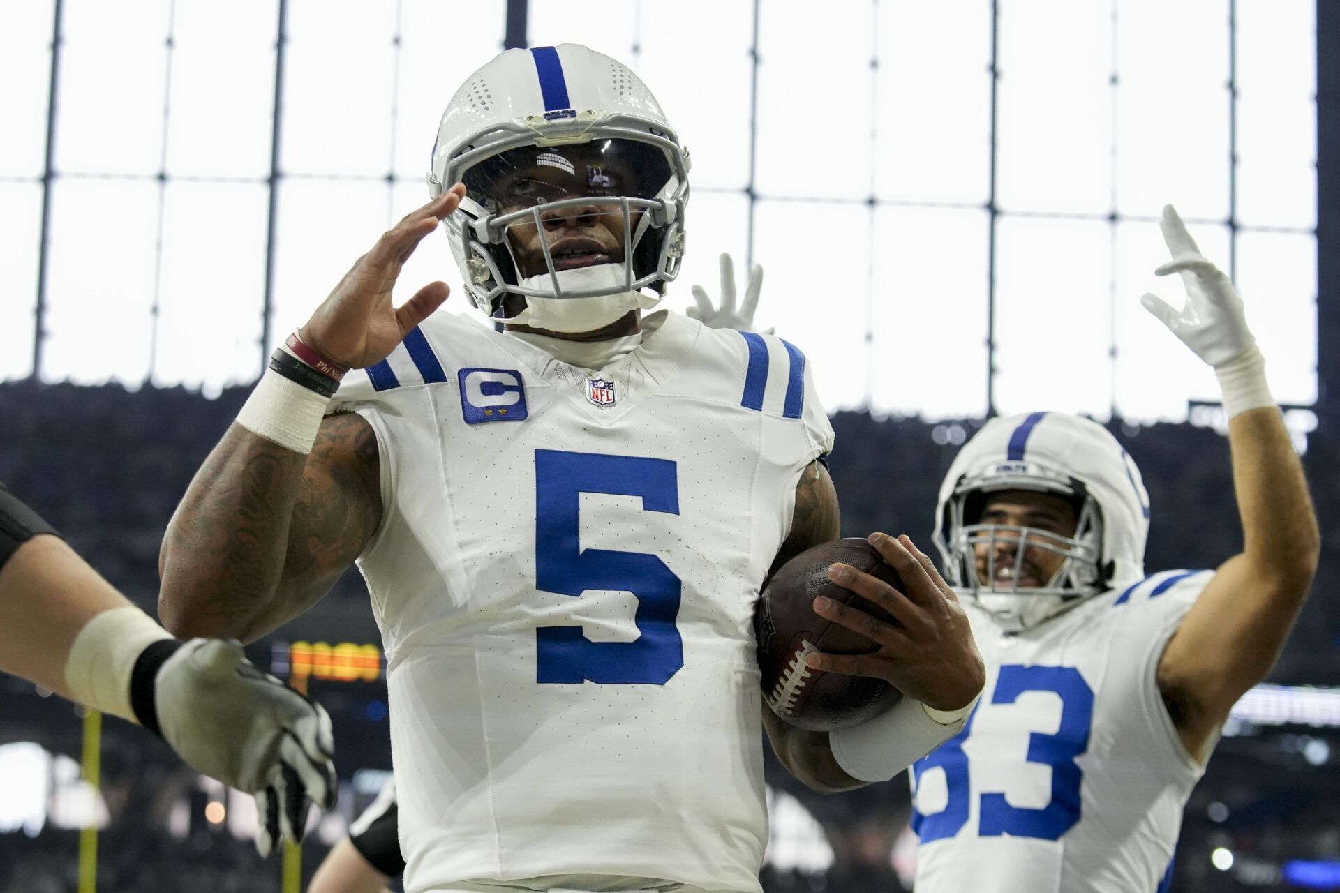 Indianapolis Colts quarterback Anthony Richardson (5) celebrates after rushing for a touchdown during a game against the Tennessee Titans at Lucas Oil Stadium.