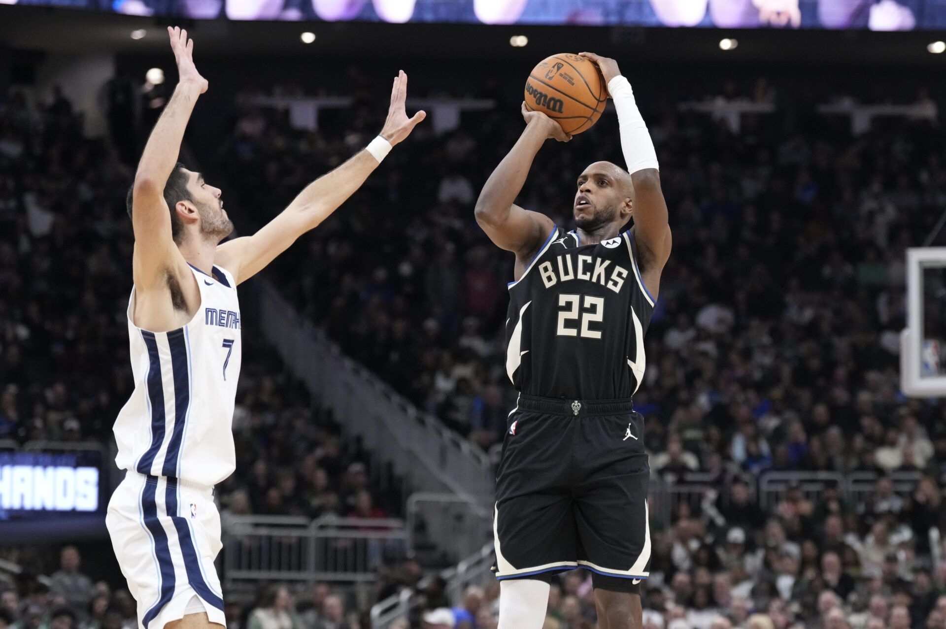 Milwaukee Bucks forward Khris Middleton (22) puts up a shot against Memphis Grizzlies forward Santi Aldama (7) in the first half at Fiserv Forum.