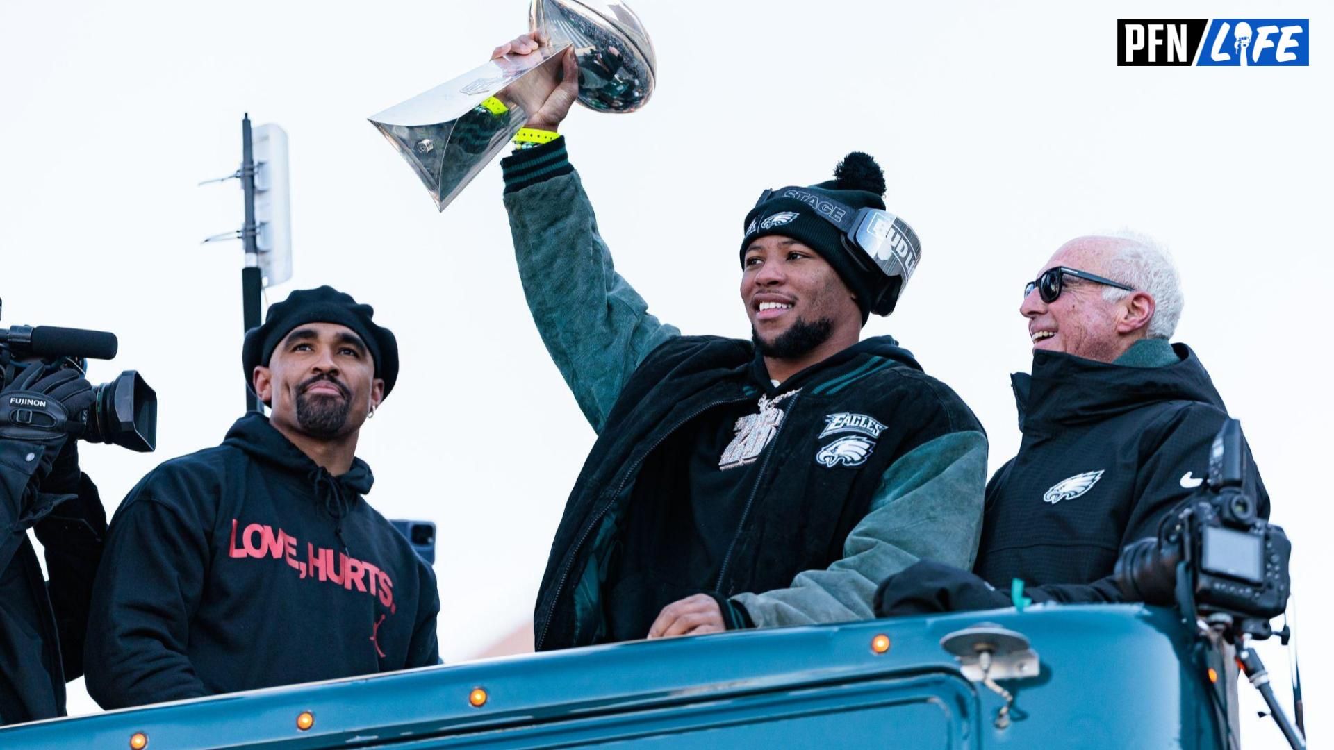 Philadelphia Eagles running back Saquon Barkley (26) lifts the Lombardi Trophy during the Super Bowl LIX championship parade and rally.