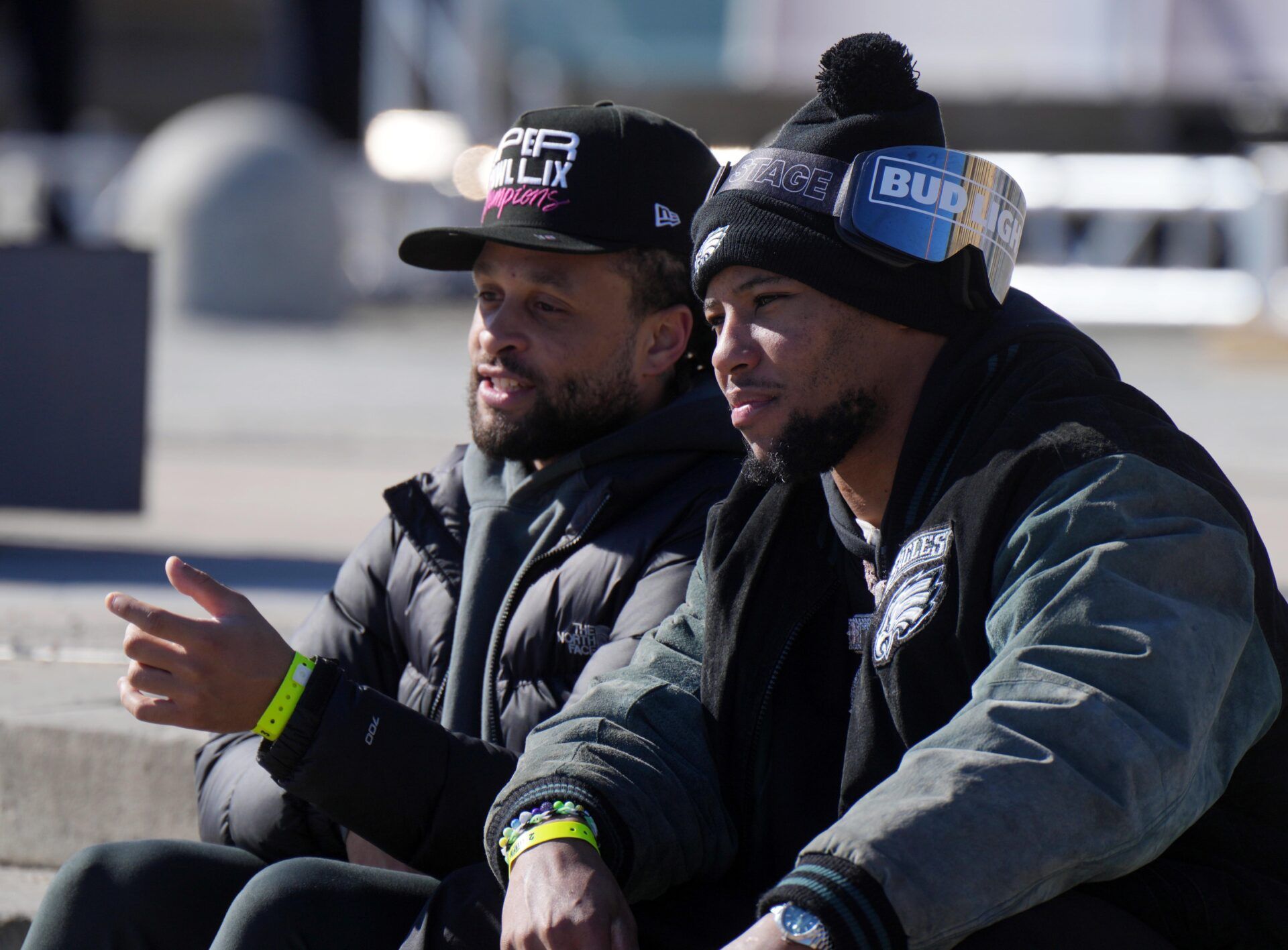 Philadelphia Eagles running back Saquon Barkley (right) and Philadelphia Eagles cornerback Avonte Maddox (left) during the Super Bowl LIX championship parade and rally.