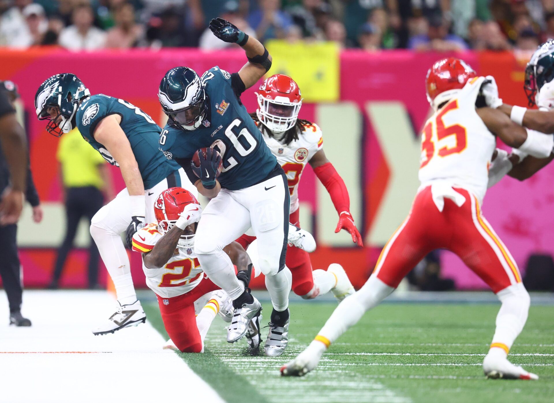 Philadelphia Eagles running back Saquon Barkley (26) runs the ball against the Kansas City Chiefs in the fourth quarter in Super Bowl LIX at Ceasars Superdome.