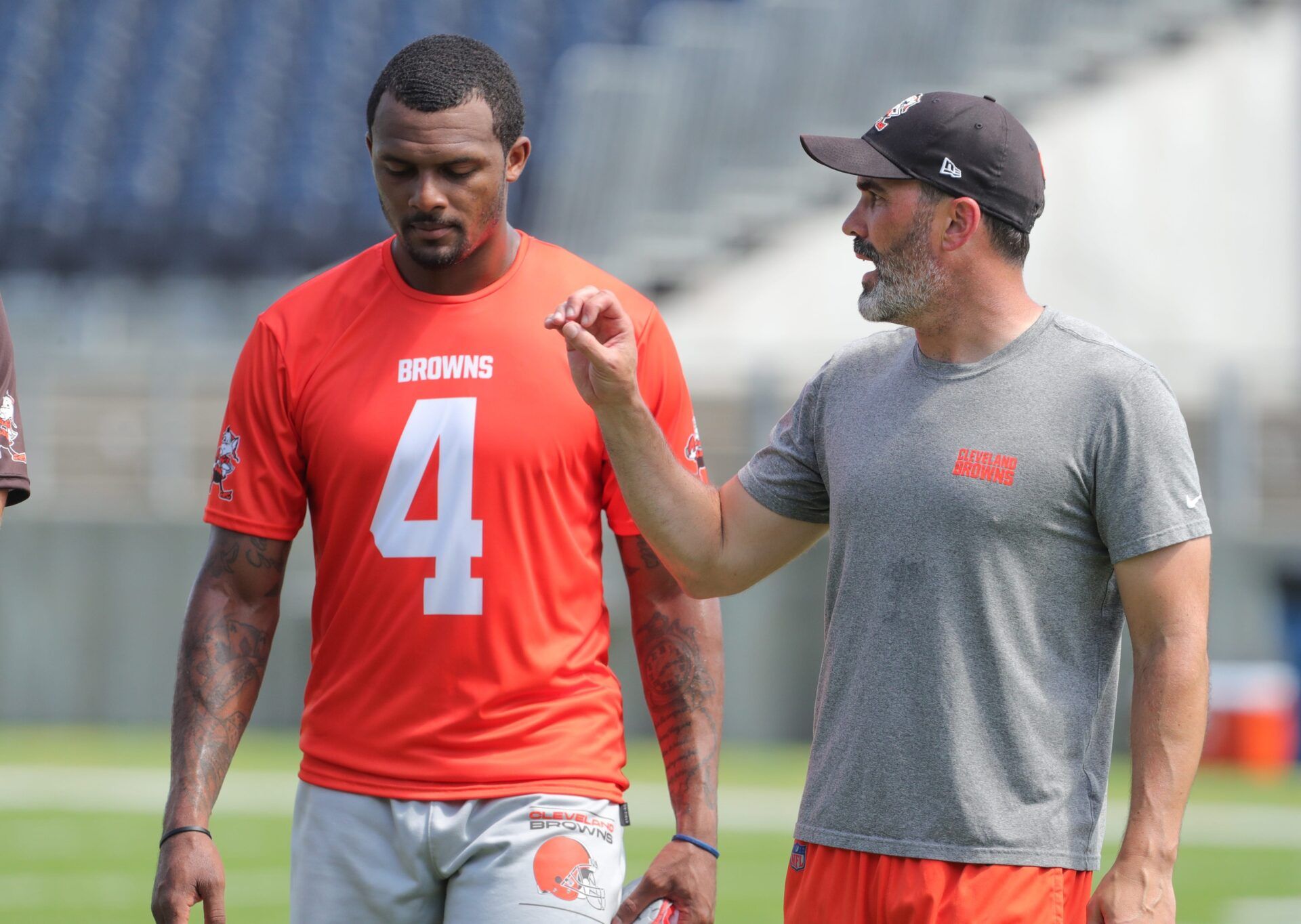 Browns quarterback Deshaun Watson talks with coach Kevin Stefanski after minicamp on Wednesday, June 15, 2022, in Canton.