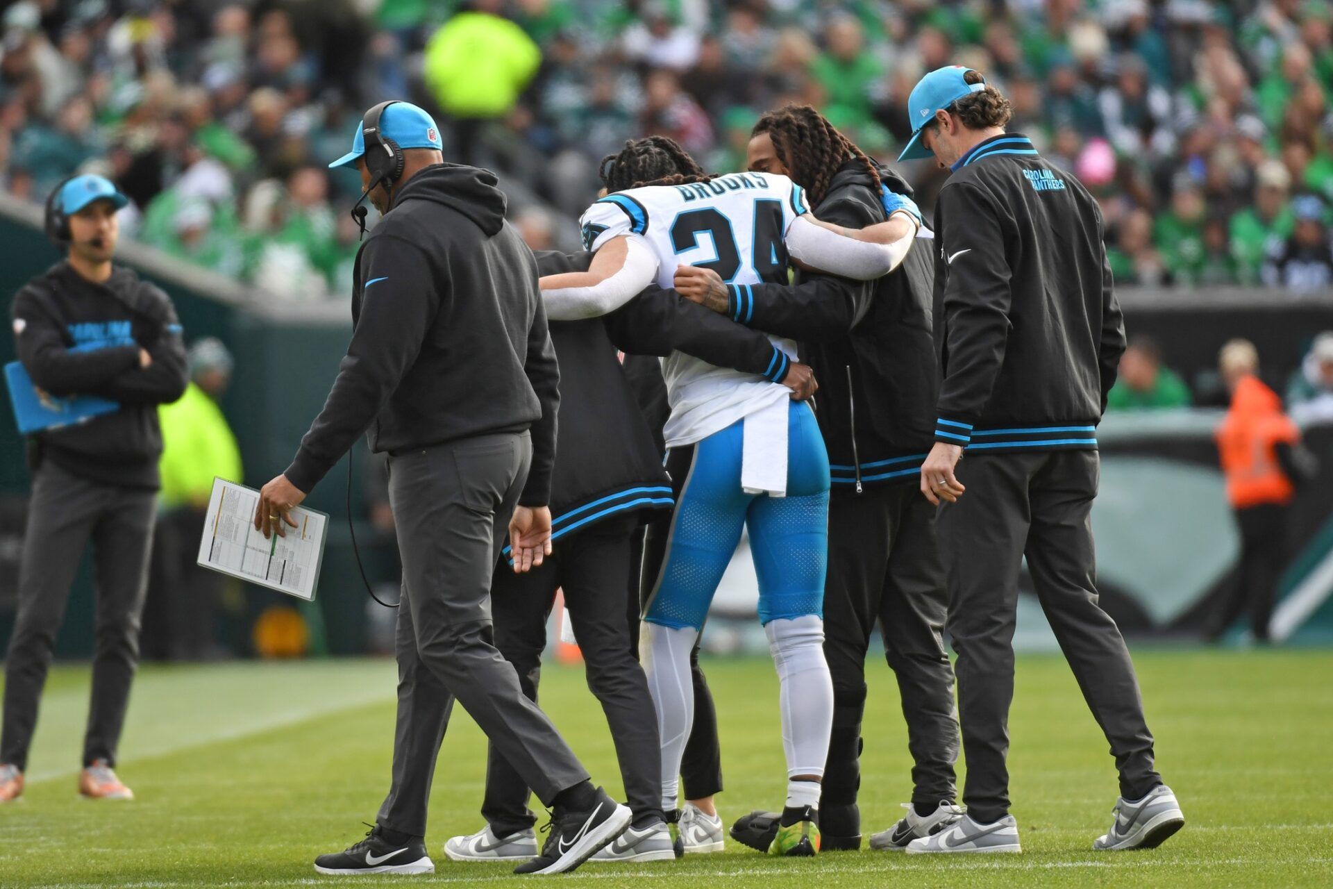 Carolina Panthers running back Jonathon Brooks (24) is helped off the field with an injury against the Philadelphia Eagles at Lincoln Financial Field.