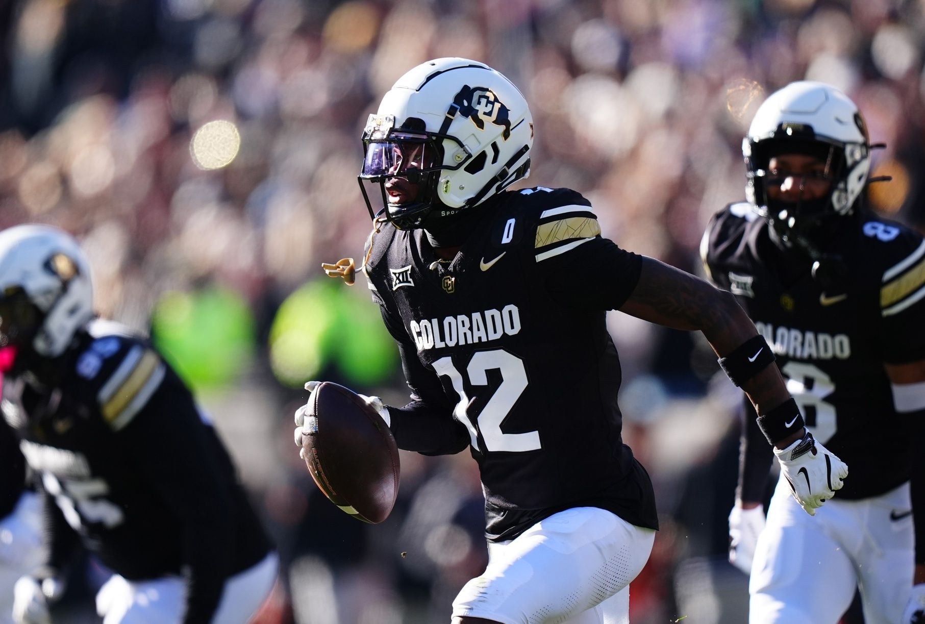 Colorado Buffaloes cornerback Travis Hunter (12) following an interception in the first quarter against the Oklahoma State Cowboys at Folsom Field.