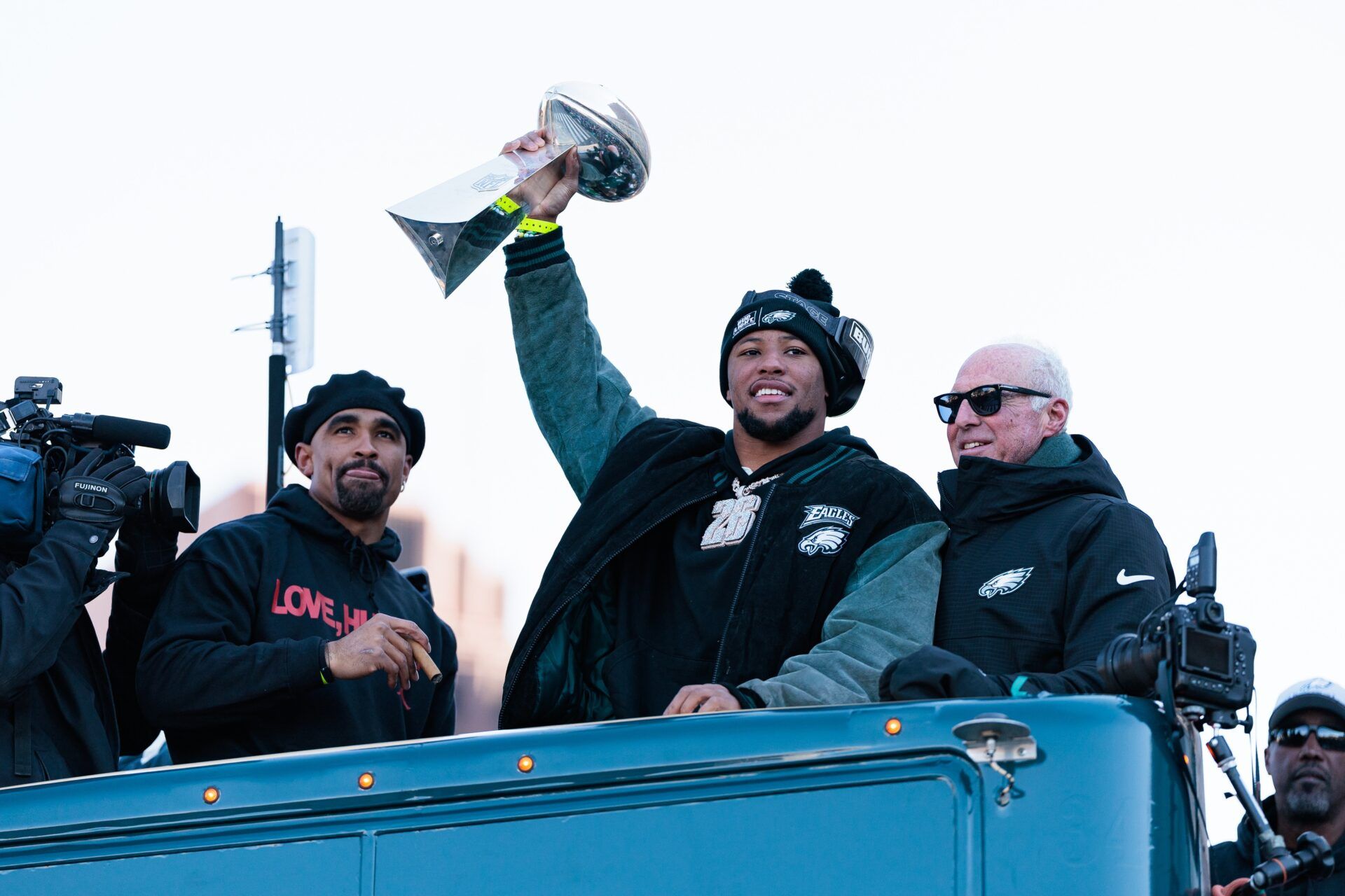 Philadelphia Eagles running back Saquon Barkley (26) lifts the Lombardi Trophy during the Super Bowl LIX championship parade and rally.