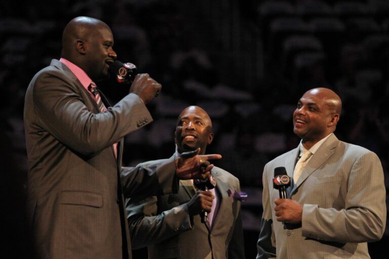 TNT anchor Kenny Smith introduces Team Shaq general manager Shaquille O'Neal and Team Chuck general manager Charles Barkley before the BBVA rising stars challenge at the Amway Center in Orlando.