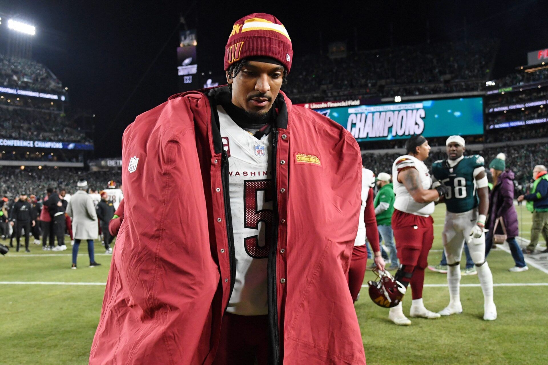 Washington Commanders quarterback Jayden Daniels (5) walks off the field after losing the NFC Championship game against the Philadelphia Eagles at Lincoln Financial Field.