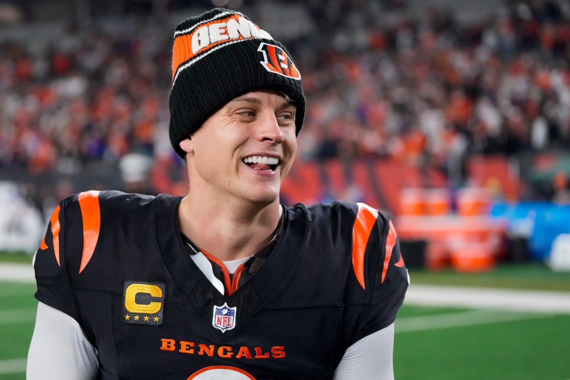 Bengals quarterback Joe Burrow celebrates a Week 17 overtime win over the Denver Broncos that kept Cincinnati's slim playoff hopes alive. Burrow threw for 412 yards and three touchdowns in the game and also added a rushing score.