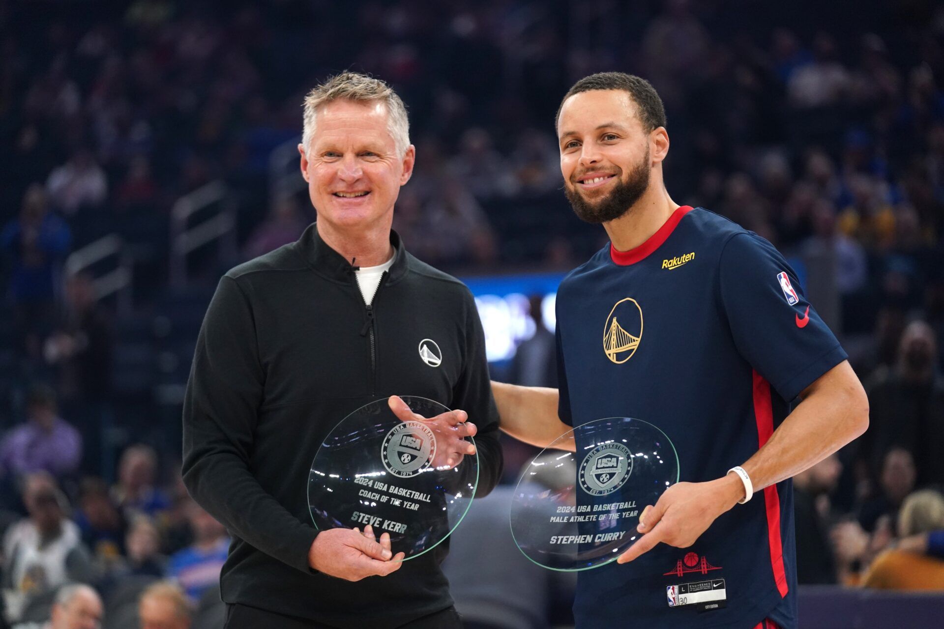 Golden State Warriors head coach Steve Kerr and guard Stephen Curry (30) are recognized as the USA Basketball head coach and male athlete of the year before the start of the game against the Oklahoma City Thunder at the Chase Center.