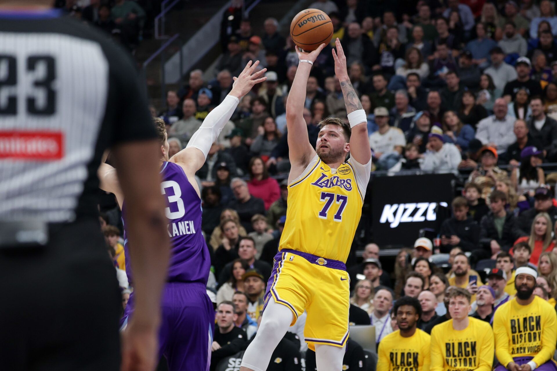 Los Angeles Lakers guard Luka Doncic (77) shoots over Utah Jazz forward Lauri Markkanen (23) during the second quarter at Delta Center.