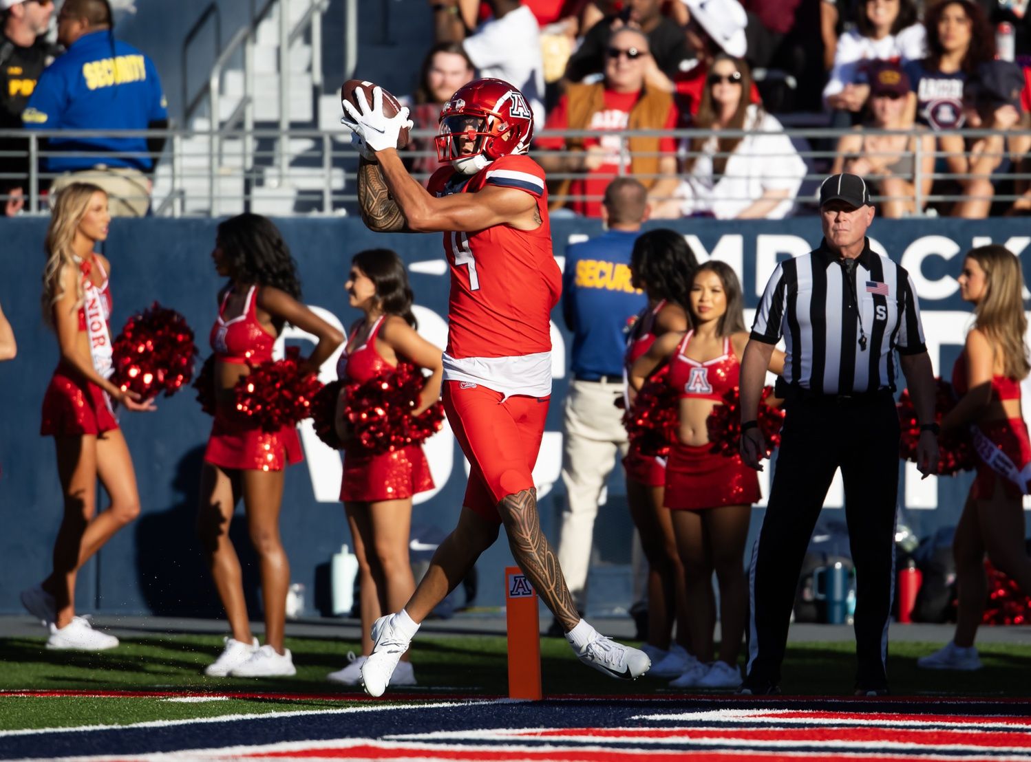 Arizona Wildcats wide receiver Tetairoa McMillan (4) catches a touchdown against the Arizona State Sun Devils in the second half during the Territorial Cup at Arizona Stadium.