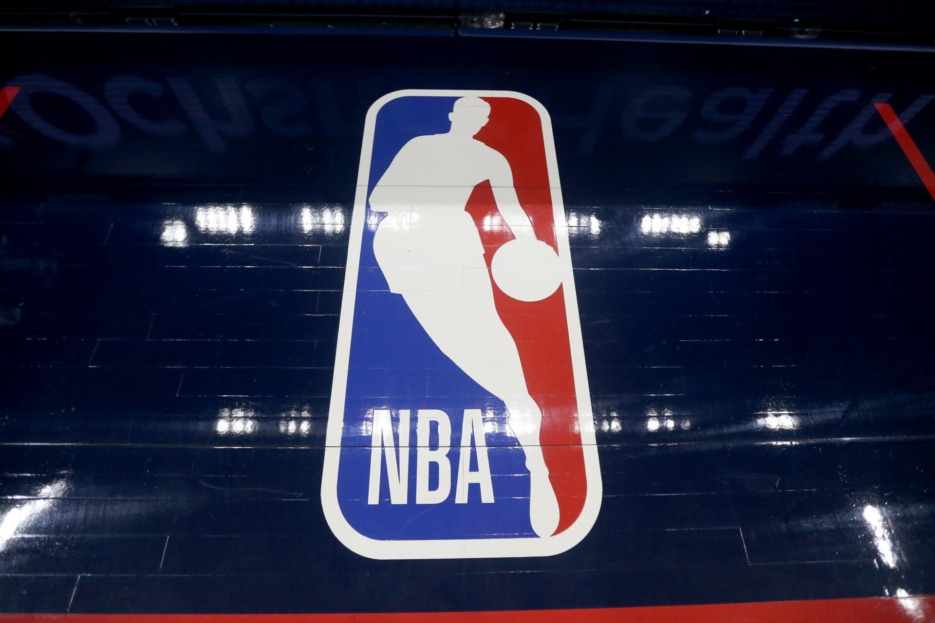 The NBA logo on the floor before the game between the New Orleans Pelicans and the Golden State Warriors at the Smoothie King Center.