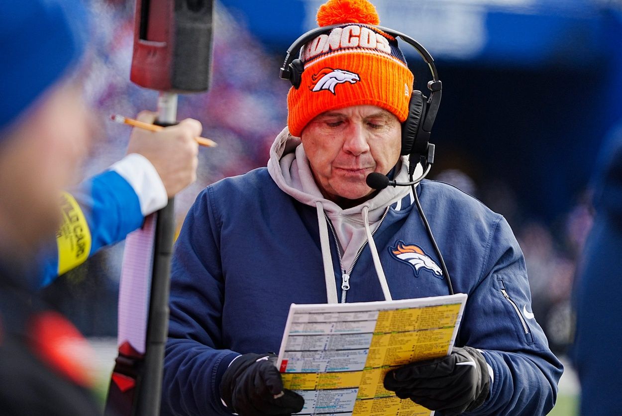 Denver Broncos head coach Sean Payton looks over the play sheet during the first half of the Buffalo Bills wild card game against the Denver Broncos at Highmark Stadium.