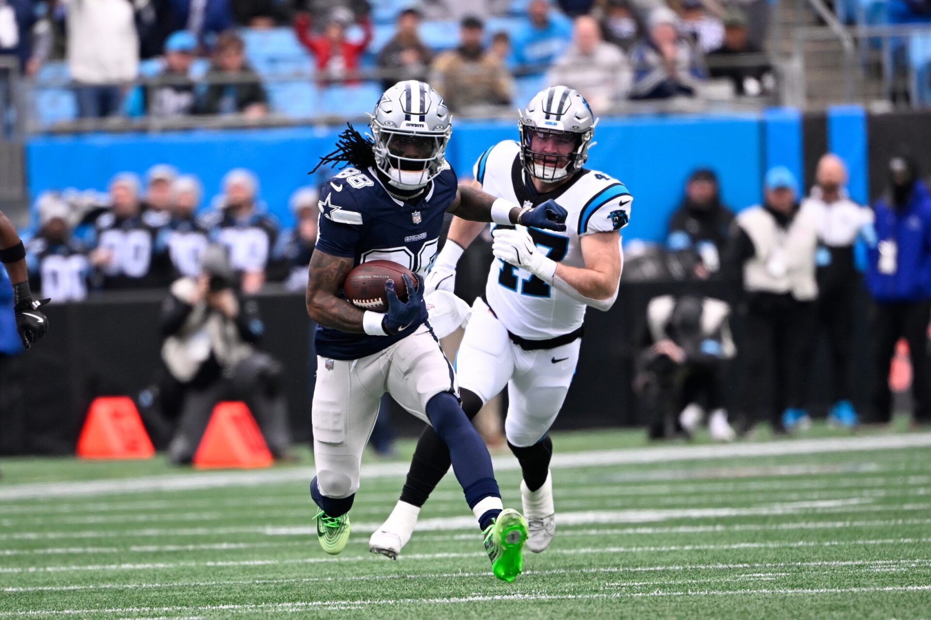 Dallas Cowboys wide receiver CeeDee Lamb (88) with the ball as Carolina Panthers linebacker Josey Jewell (47) defends in the first quarter at Bank of America Stadium.