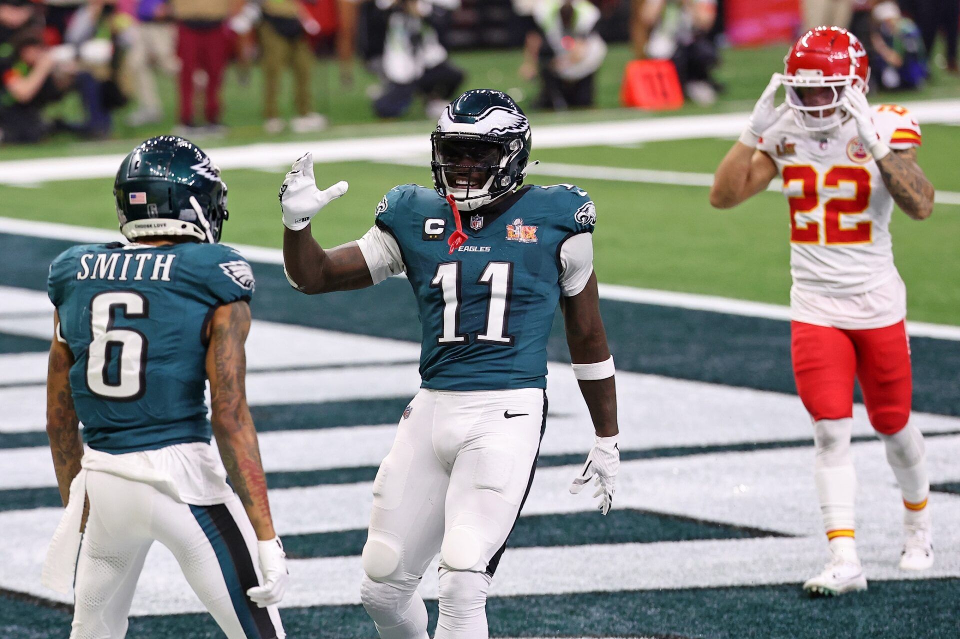 Philadelphia Eagles wide receiver A.J. Brown (11) congratulates wide receiver DeVonta Smith (6) after he scored a touchdown against the Kansas City Chiefs during the second half of Super Bowl LIX at Caesars Superdome.